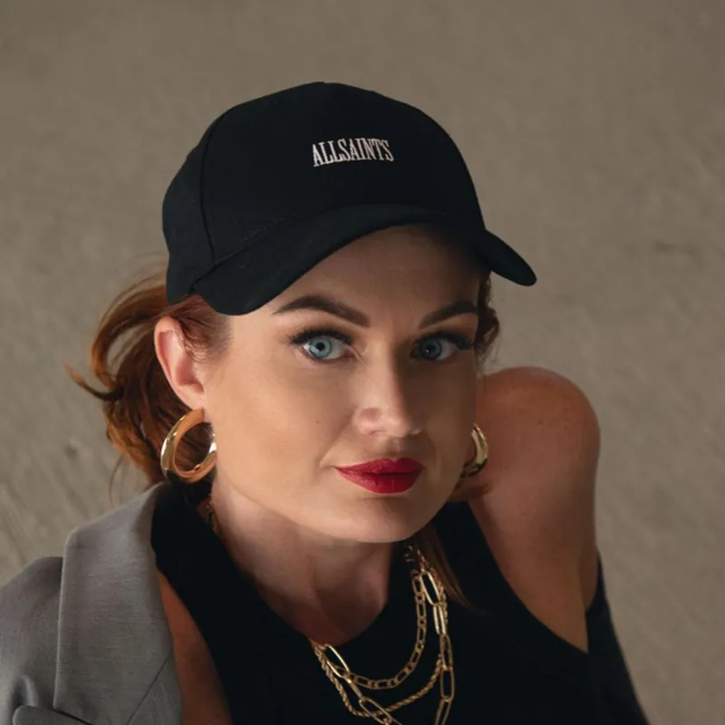 Portrait of Dominika Tsybina's mom wearing a black cap